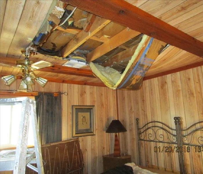 Paneling and insulation collapsed from water burst water pipe during a freeze.