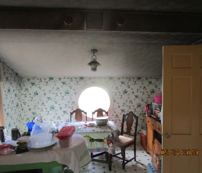 Picture of a sooty eat in area of the kitchen that was close to the fire