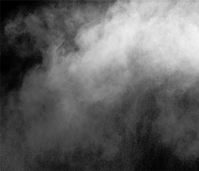 smoke in front of a black background