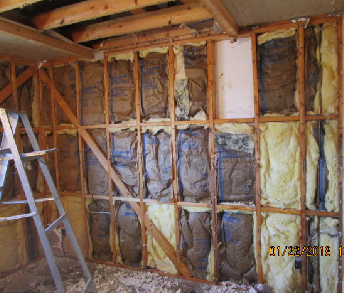 The site of a burst ceiling pipe after the drywall was removed